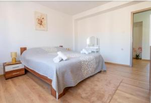 Postel nebo postele na pokoji v ubytování Apartment MIA