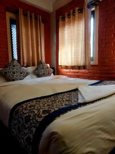Postel nebo postele na pokoji v ubytování Hotel Garuda