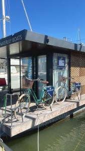 two bikes parked on a dock in the water at Casas Flotantes - Boatvillage in Ayamonte
