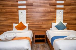 Ένα ή περισσότερα κρεβάτια σε δωμάτιο στο Hotel Glory Garden