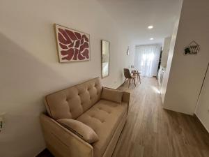 a living room with a couch and a table at White House in Castellón de la Plana