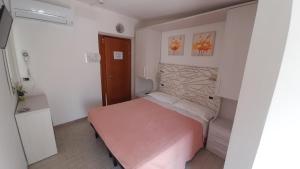 Postel nebo postele na pokoji v ubytování Hotel Luana