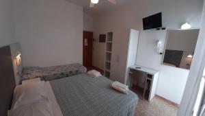 Postel nebo postele na pokoji v ubytování Hotel Luana