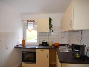 a kitchen with a sink and a counter top at Wonderful Apartment in Elpe with Garden in Elpe