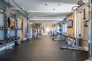 a gym with cardio equipment and treadmills at Rincon Hill 1BR w AC Gym nr Bay Bridge SFO-156 in San Francisco