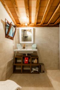 a bathroom with a sink and a mirror at Luxury House in Green Appia Antica in Rome