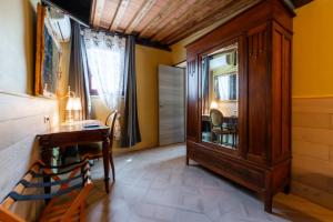 a room with a desk and a dresser and a window at Luxury House in Green Appia Antica in Rome