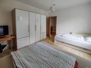 Postel nebo postele na pokoji v ubytování FEWO Jänschwalde II