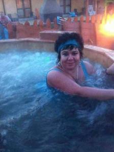 a woman in a hot tub in a swimming pool at Villa Marcus in Rowy