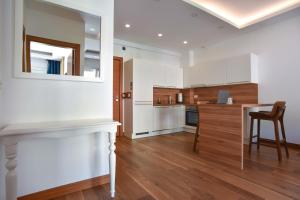 Kuchyň nebo kuchyňský kout v ubytování New Chill and Go Apartments
