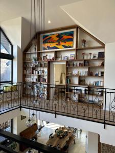 a living room with a table and a balcony at Balkonum Luxury Guest House in Gosh