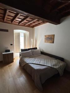 Ένα ή περισσότερα κρεβάτια σε δωμάτιο στο Casa Juvarra