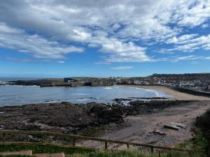 a view of a beach with the ocean at Belmont House Boutique - the Kingsley collection in Berwick-Upon-Tweed