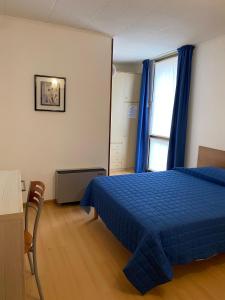 Postel nebo postele na pokoji v ubytování Hotel Meublè Villa Patrizia