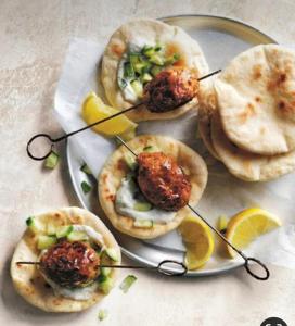 a plate of food with meatballs and pita bread at Cavala The Seaside Resort, Baga in Baga