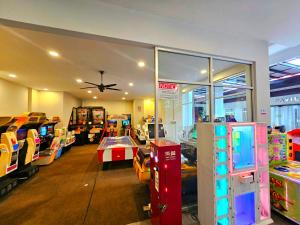a store with many video games in a room at BY LG Water Themepark Facilities & Suites By GGM in Melaka