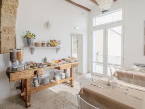 a room with a table with food on it at Tannur B&B in Castellammare del Golfo