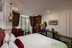 Postel nebo postele na pokoji v ubytování Vision Premier Hotel in Hanoi Central