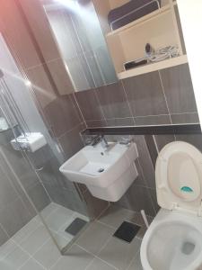 a bathroom with a toilet and a sink at Walking gate camp Humphreys in Pyeongtaek