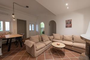 a living room with a couch and a table at Memories Gytheio in Gythio