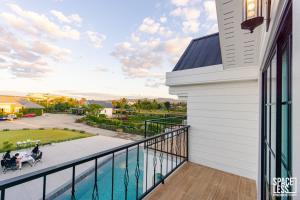 a balcony with a view of a yard at The Autumn Creek Chiangrai in Chiang Rai