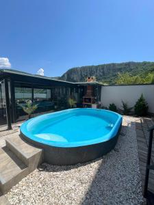 a large blue swimming pool on a patio at CASA DAVID in Dubova