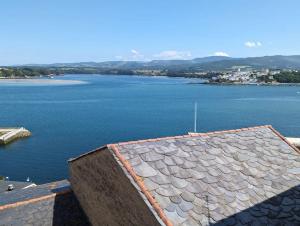 a view of a large body of water at Casa Buenos Aires in Ribadeo +3 photos