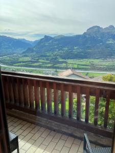 a balcony with a view of the mountains at Hotel Restaurant Kulm in Triesenberg
