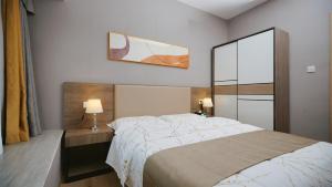 Serveyou International Apartment Hotel - Free Airport Pickup & Free Canton Fair shuttle & Paid City Tour 객실 침대