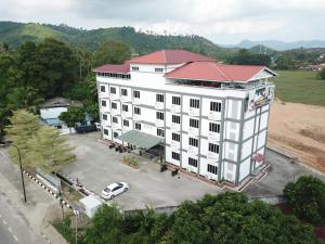 an overhead view of a white building with a red roof at Salsa Resort Langkawi By Casa Loma in Pantai Cenang