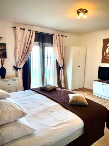 Postel nebo postele na pokoji v ubytování Apartments Casa Toni Dubrovnik