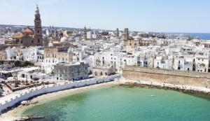 an aerial view of a city with a body of water at Casa Perricci - short lets - Monopoli in Monopoli