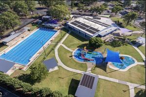 an overhead view of a swimming pool at a park at MJED House in Ingleburn