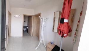 a room with a hallway with a red umbrella on the wall at APARTMÁNY I&V - Adults Only in Pilsen +61 photos