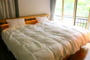 Postel nebo postele na pokoji v ubytování 那須リゾートMOMIJI room stay