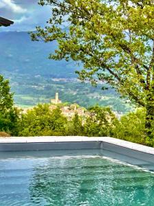 a swimming pool with a view of a city at Villa Lux in Poppi