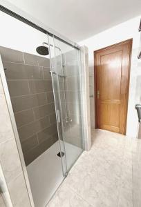 a shower with a glass door in a bathroom at CASA LORENZO in the center in Playa Blanca +7 photos