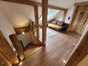 an overhead view of a living room with a couch at A l'air de Storck - Gîte de montagne 4 étoiles 6-8 personnes in Storckensohn