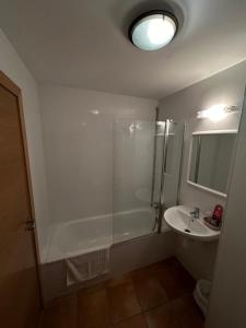 a bathroom with a shower and a sink at Hostal Centre Del Montsec in Llimiana