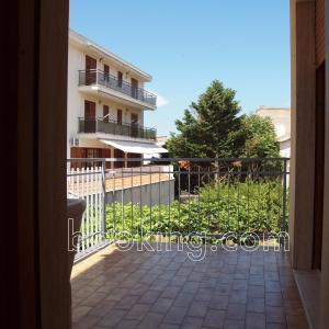 a balcony of a building with a fence at InternoUno in Diamante