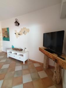 A television and/or entertainment centre at La Villa Tanca Piras