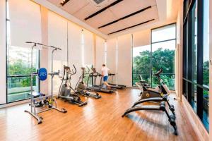 a man in a gym with several exercise bikes at Condo 1 bed in Phuket City Center 8th Floor in Ban Rangeng