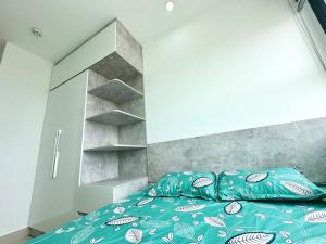 A bed or beds in a room at Homestay Apartment Huế Thương