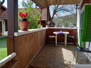 an outdoor patio with a table and a table at Casa anca in Lunca