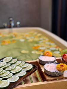 two trays of cucumbers in a pool of water at Flowering Villa in Xiaoliuqiu