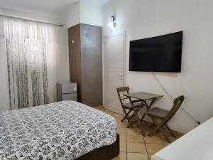 TV a/nebo společenská místnost v ubytování Bed and Breakfast Alberini