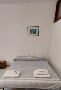 Postel nebo postele na pokoji v ubytování Da Rox Porto Torres