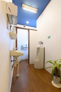 a bathroom with a sink and a toilet at OYO Ryokan Hamanako no Yado Kosai - Vacation STAY 48856v in Kosai