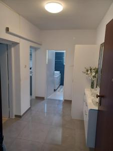 a room with a bathroom with a sink and a mirror at Studio apartman Marija in Trogir +8 photos