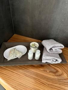 a tray with a plate and towels on a table at Sora al Ponte in Chioggia